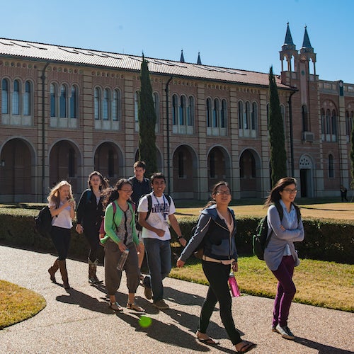 Undergraduate students walking in the quad