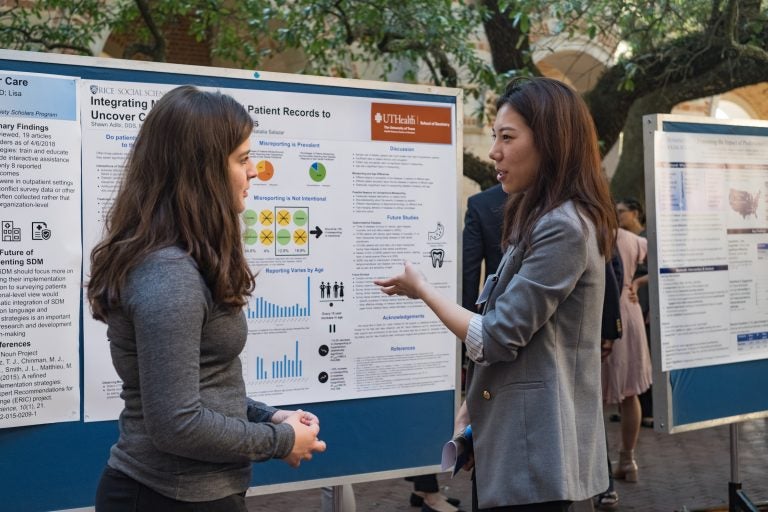 Students presenting a research poster