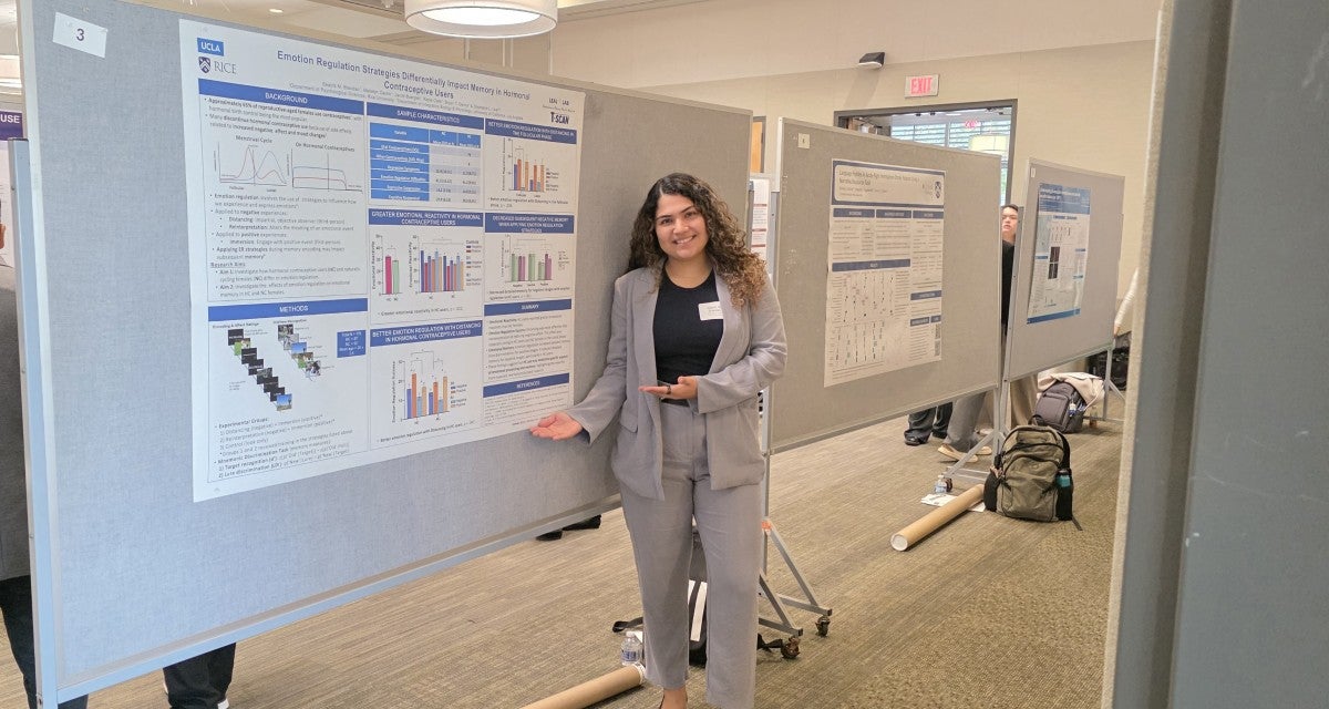 Beatriz Brandao with research poster, Rice University School of Social Sciences