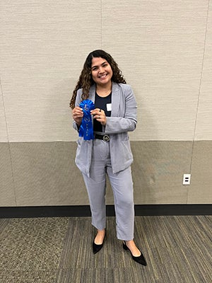 Beatriz Brandao with award, Rice University School of Social Sciences