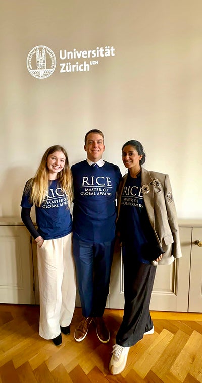 Three students wearing shirts that say "Rice Master of Global Affairs"