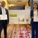 Rice University Master of Energy Economics students holding awards in front of their research poster at the Port of the Future conference