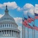 capitol dome and american flags